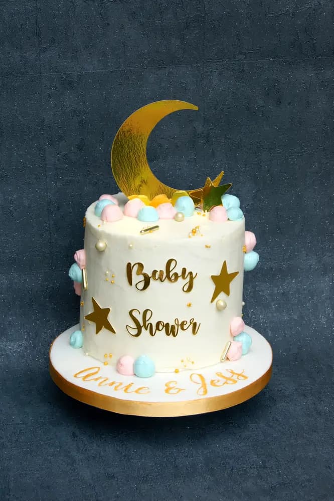 Elegant pastel baby shower cake with fondant detail