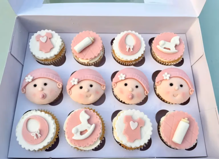 Baby shower cake with floral and ribbon decoration