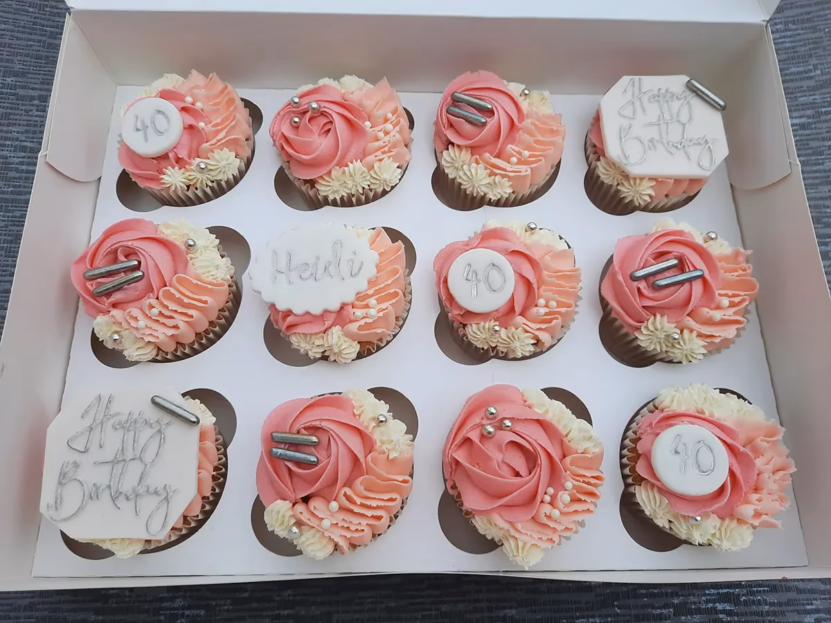40th birthday cupcakes in pink and cream with silver sprinkle decoration
