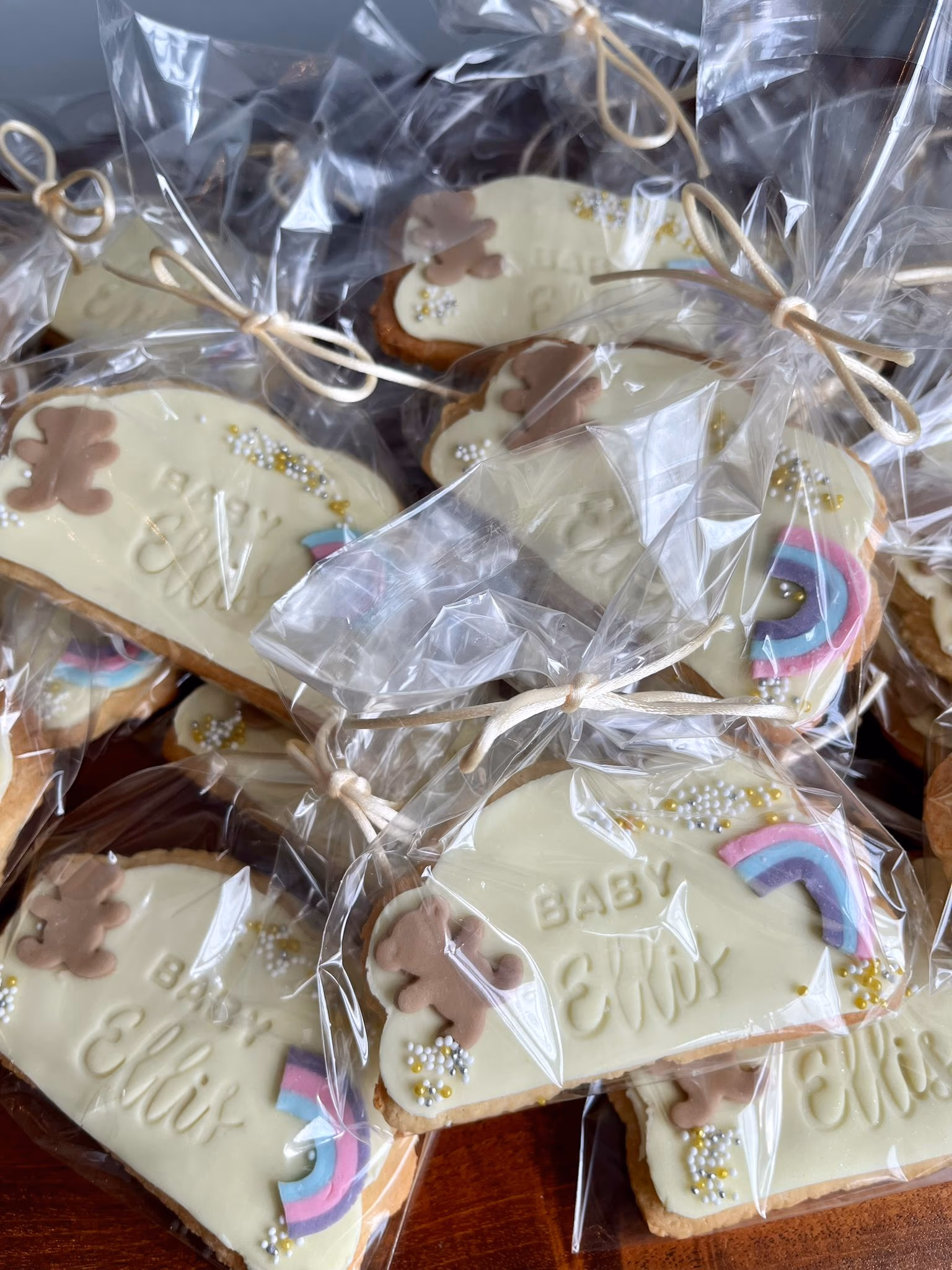Teddy bear christening iced biscuits with rainbow sprinkles by Thelwall Bakehouse