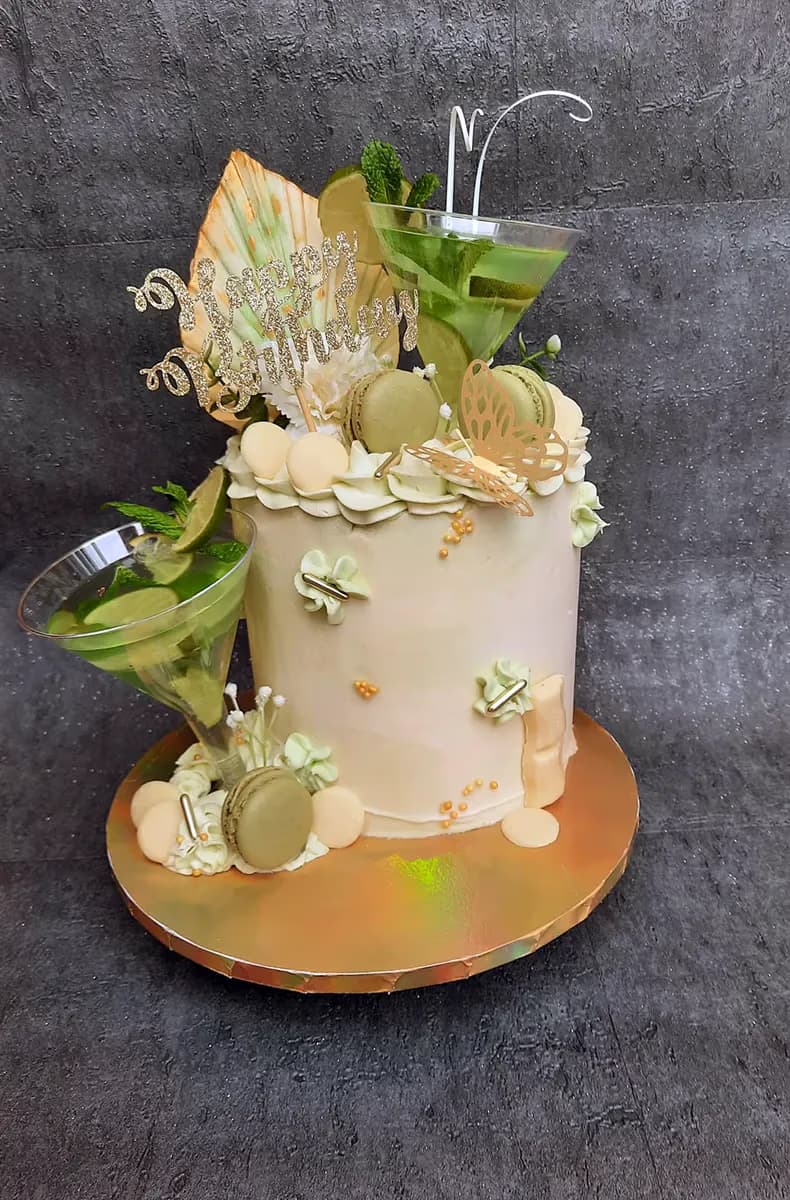 Mojito themed birthday cake in green and gold with macarons