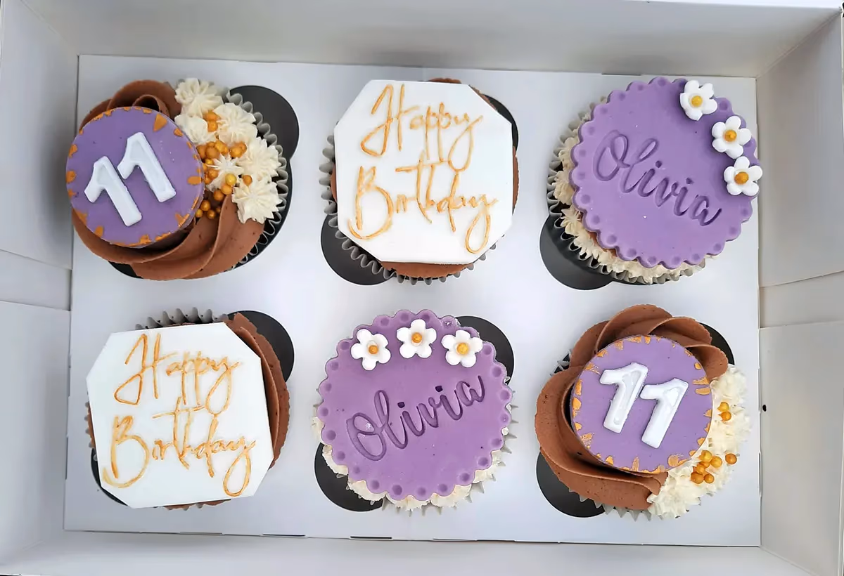 Purple and gold birthday cupcakes for an 11th birthday by Thelwall Bakehouse