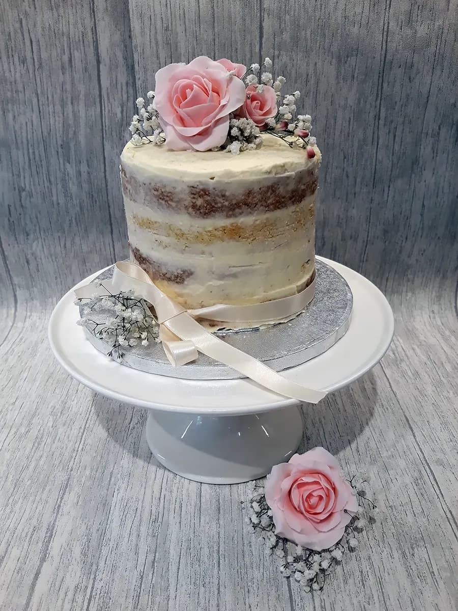 Floral wedding cake with sugar flowers by Thelwall Bakehouse