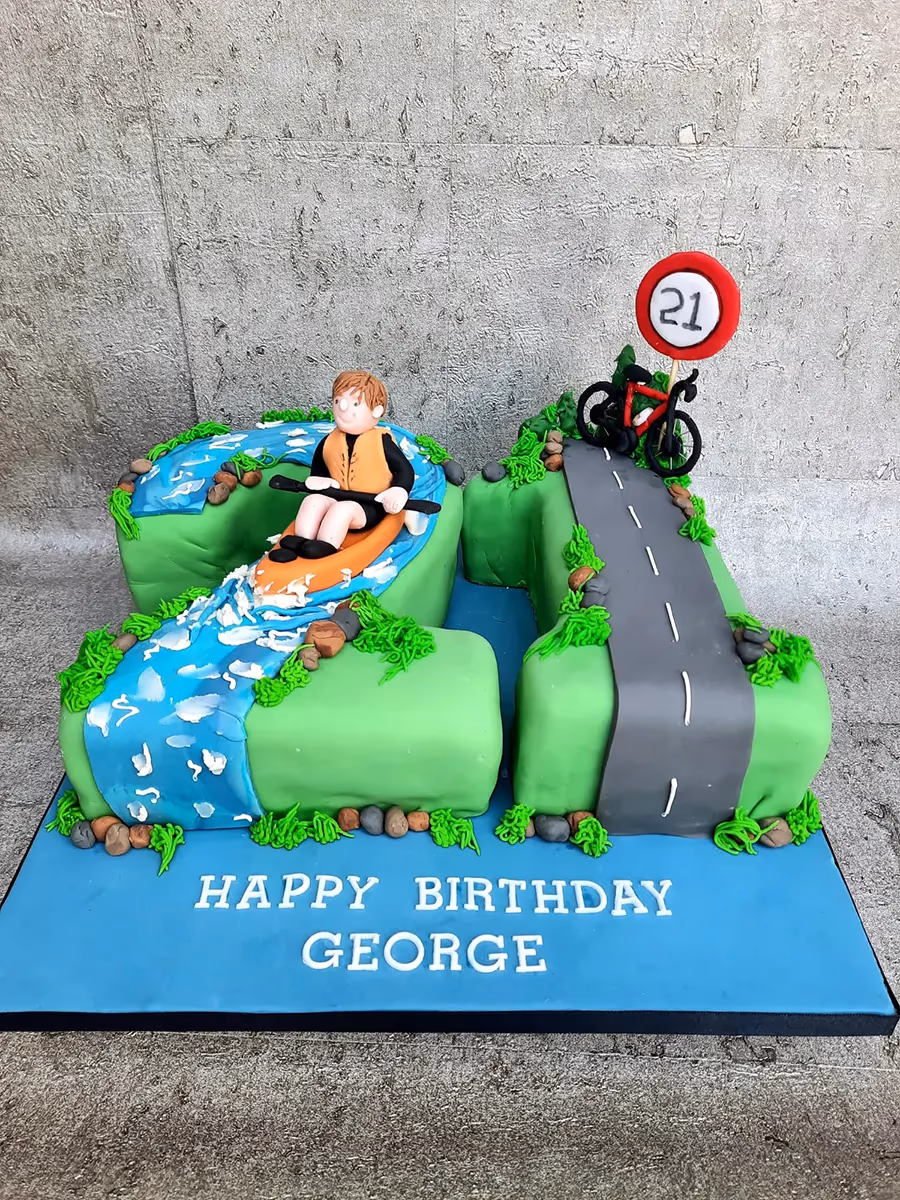 21st birthday cake shaped as the number 21 with a kayaking river and a cycling road