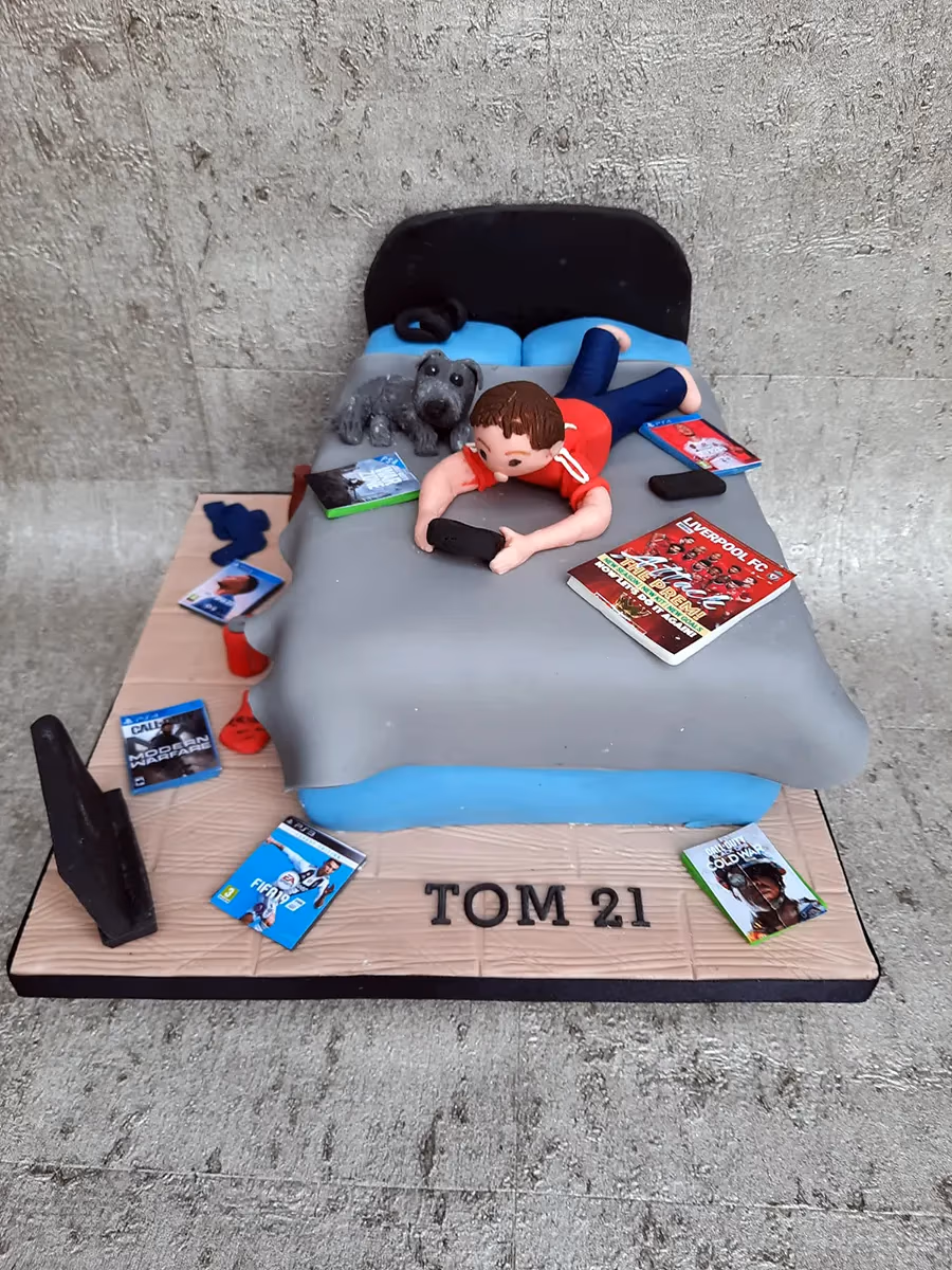 21st birthday cake with gamer, bed and Liverpool FC decorations
