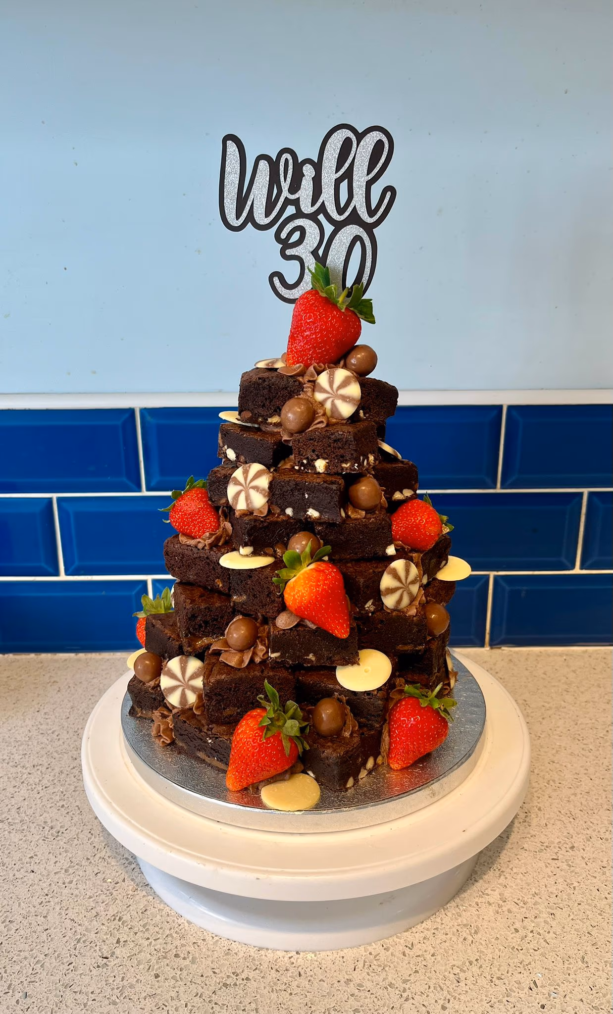 Brownie stack for a 30th birthday with strawberries and chocolates by Thelwall Bakehouse