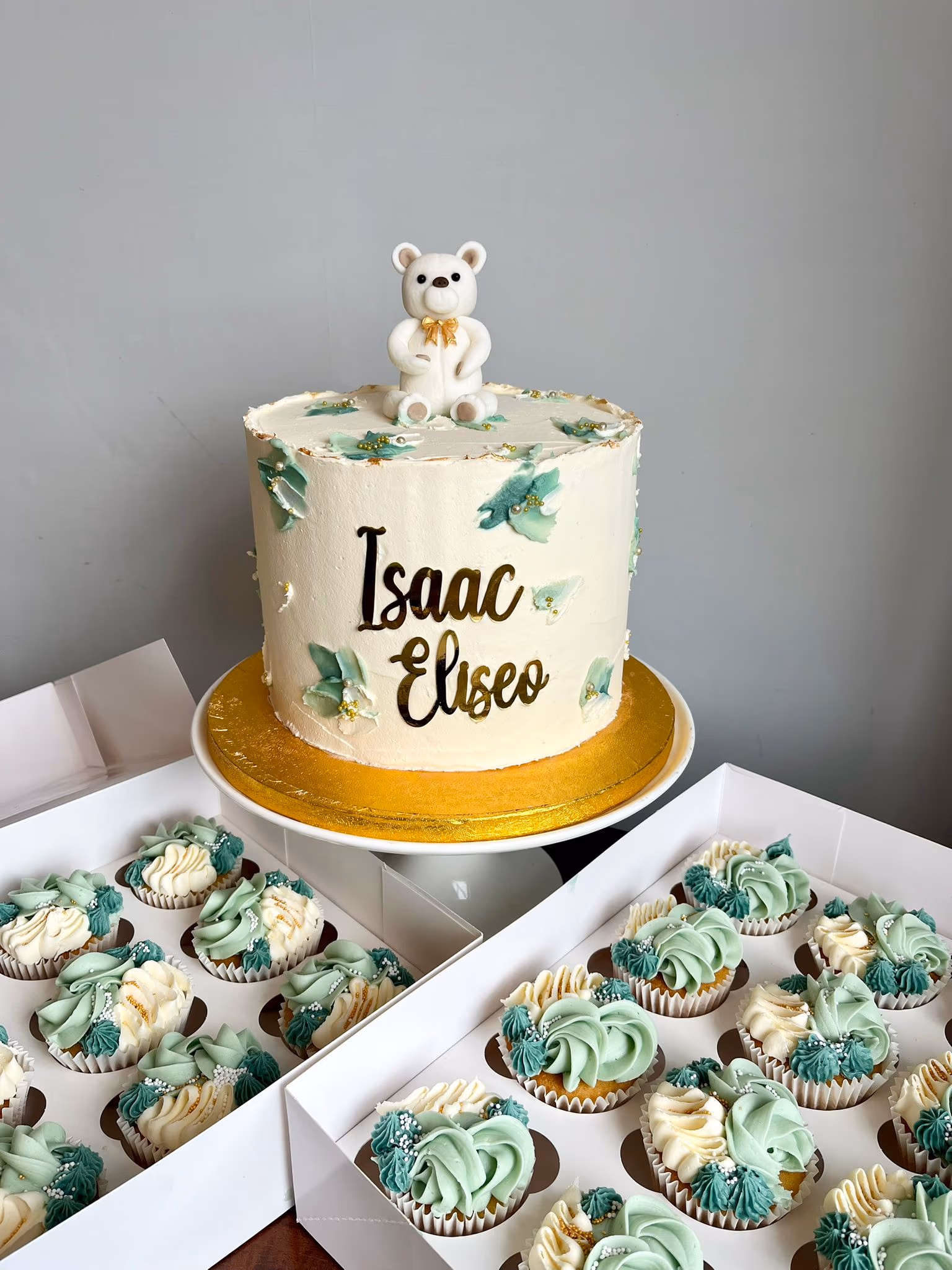 Christening baby cake white teddy bear green gold cupcakes