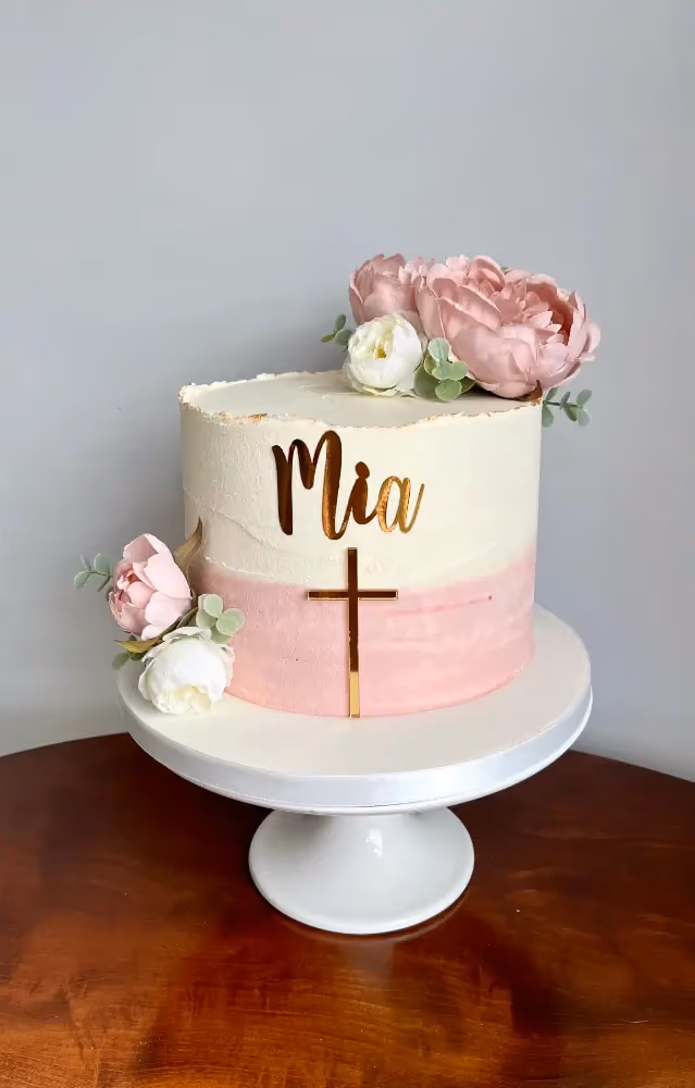 Pink ombre christening cake with a gold cross