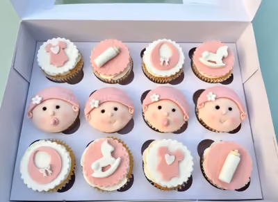 Baby shower cake with floral and ribbon decoration