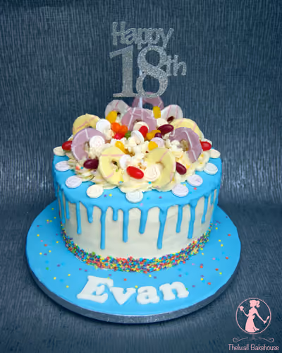 Blue drip 18th birthday cake with candy topper
