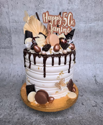 White chocolate drip 50th birthday cake with gold decorations